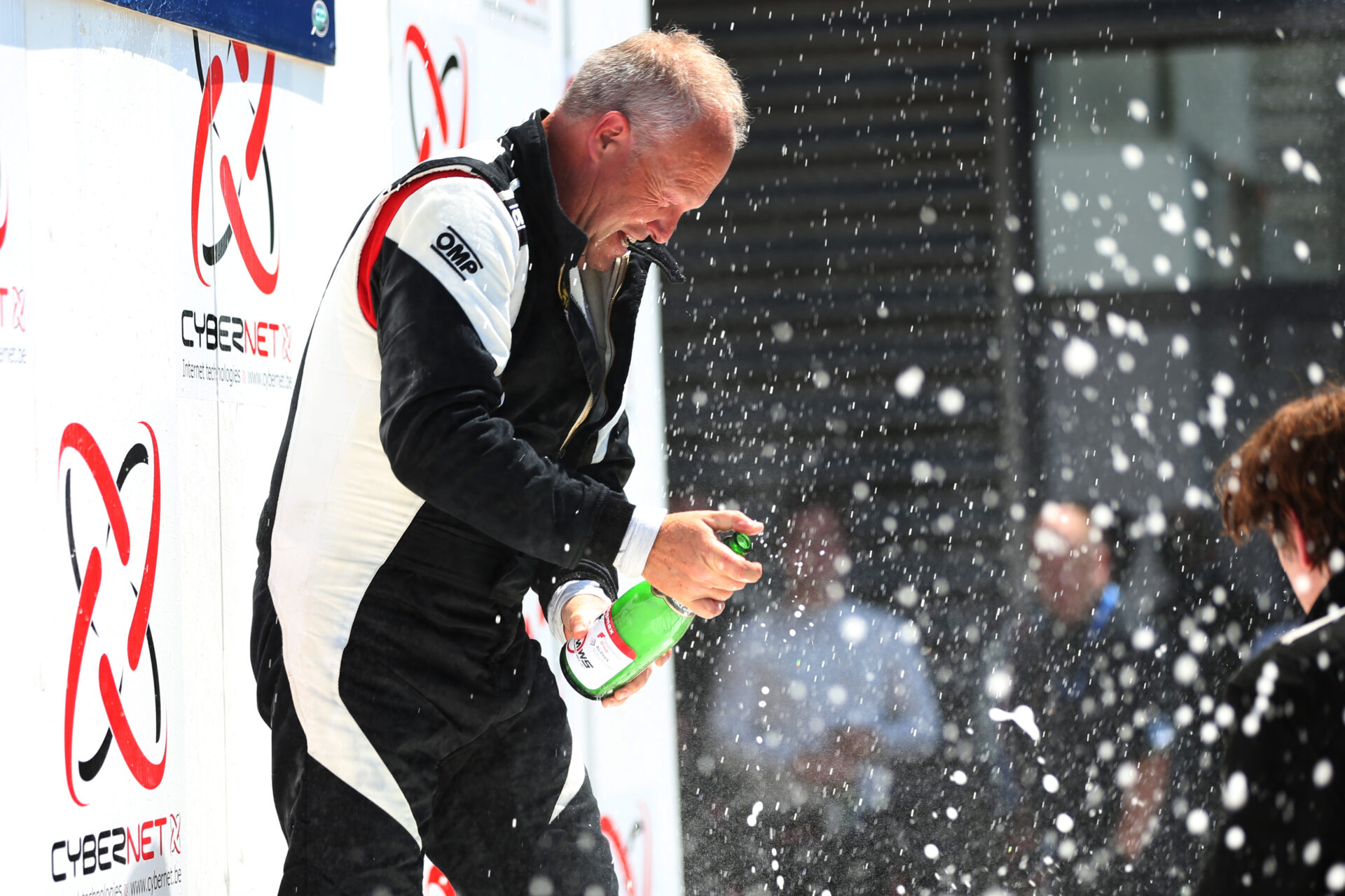 Race winner celebrating with Champagne